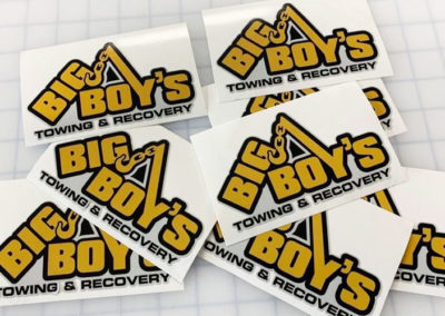 Photograph of multiple vinyl decals for Big Boy's Towing and Recovery.
