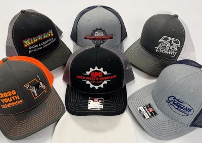 Image showing a variety of hats with embroidered logos.