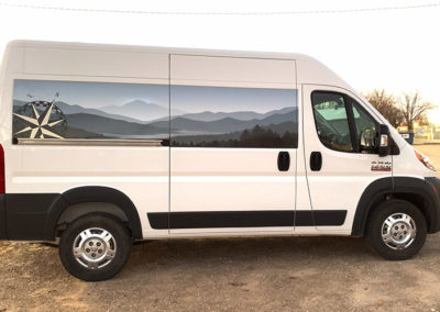 Photo showing a partial wrap on a van that creates the illusion of a window.