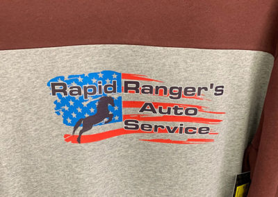 Image of a hoodie with digital heat transfer for Rapid Ranger's Auto Service.