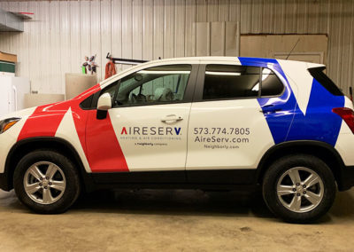 Blue and Red Vinyl Wrap of AireServ Vehicle