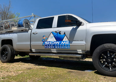 Picture of a silver pickup truck with vinyl decals and lettering for Show Me Curb Appeal Power Washing.