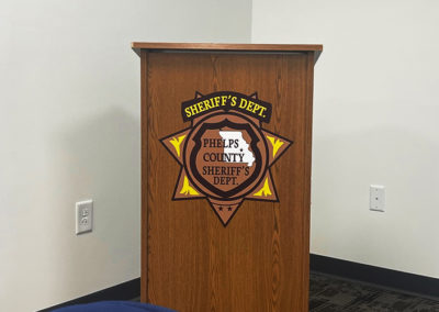 Picture of a podium with a custom vinyl decal.