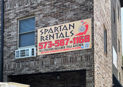 Picture of an outdoor sign for Spartan Rentals.