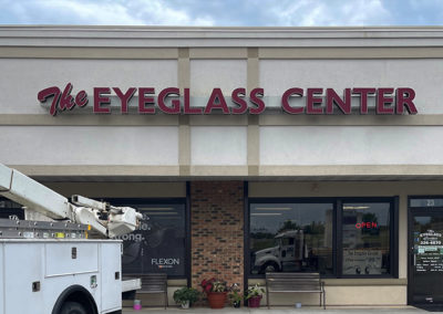 Image of LED Channel Letters reading "The Eyeglass Center" on the exterior of a store.